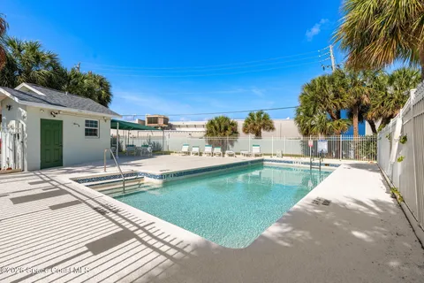 a view of a swimming pool with a lounge chairs