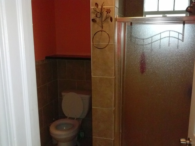 31556 South State Line Road Beecher, IL 60401 - Photo 23 of 25 a bathroom with a toilet and a shower