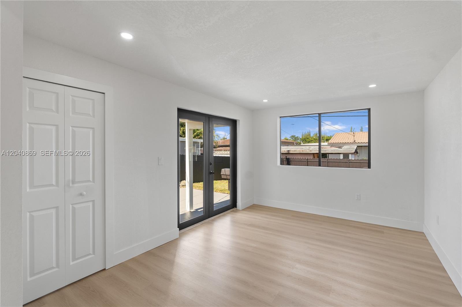 31 West 64th Street Hialeah, FL 33012 - Photo 24 of 49 wooden floor in an empty room with a window