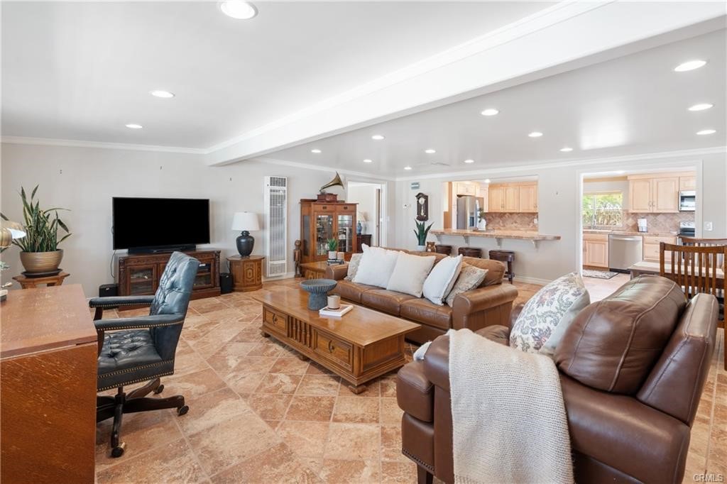 66125 Brant Cross Joshua Tree, CA 92252 - Photo 16 of 35 a living room with furniture and a flat screen tv