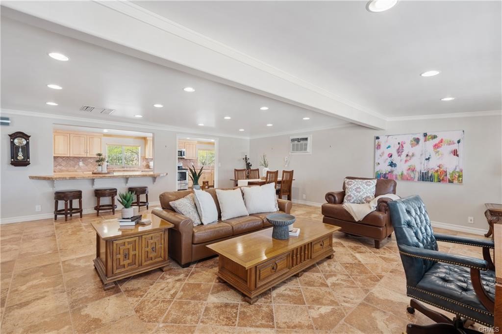 66125 Brant Cross Joshua Tree, CA 92252 - Photo 19 of 35 a living room with furniture and a dining table with kitchen view