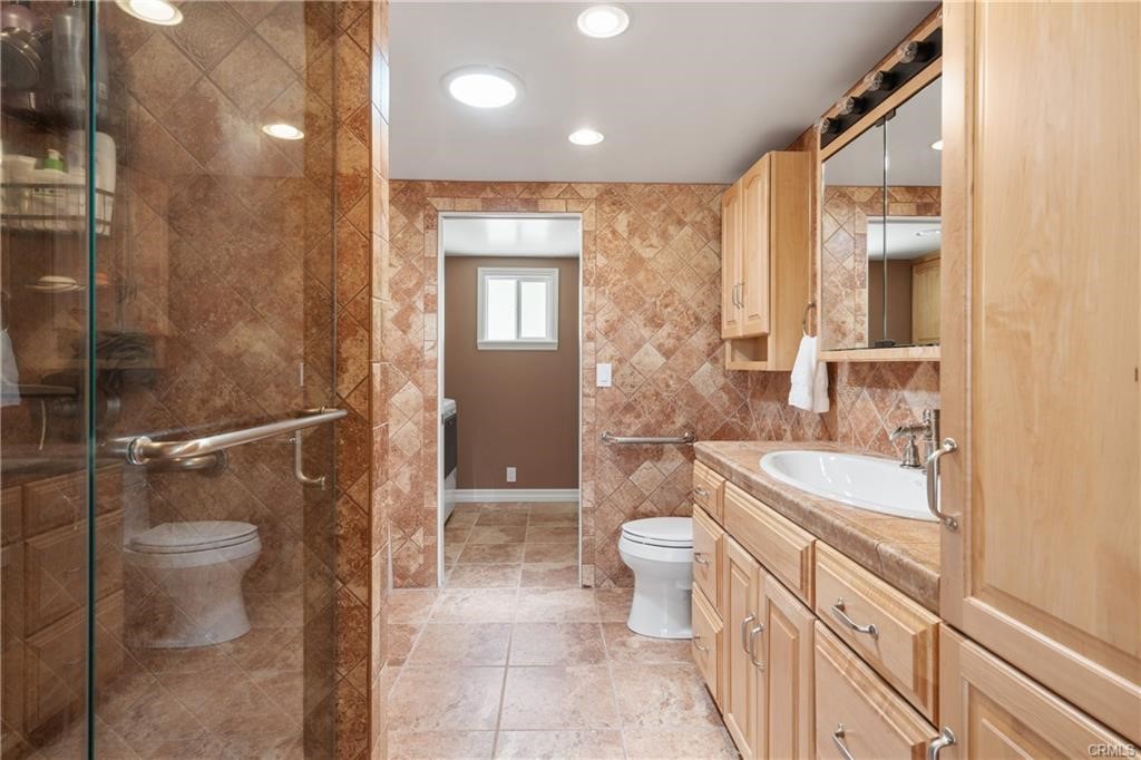 66125 Brant Cross Joshua Tree, CA 92252 - Photo 24 of 35 a bathroom with a sink a toilet and shower