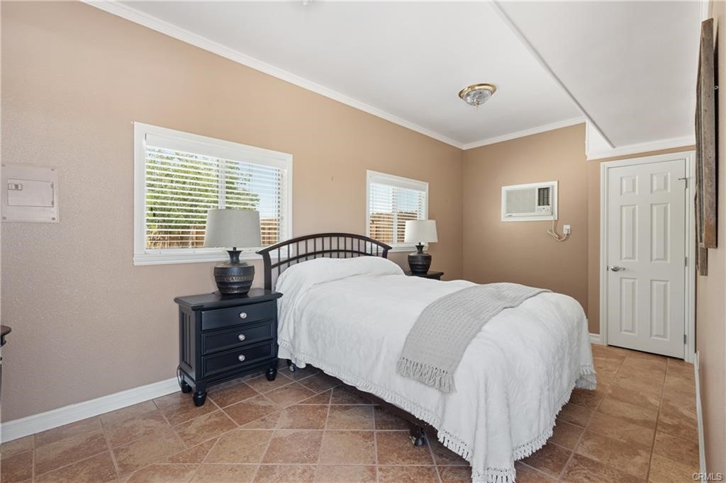 66125 Brant Cross Joshua Tree, CA 92252 - Photo 28 of 35 a bedroom with a bed and a window