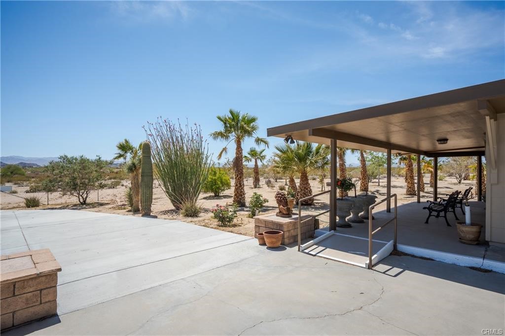 66125 Brant Cross Joshua Tree, CA 92252 - Photo 8 of 35 a view of a patio with swimming pool and sitting area