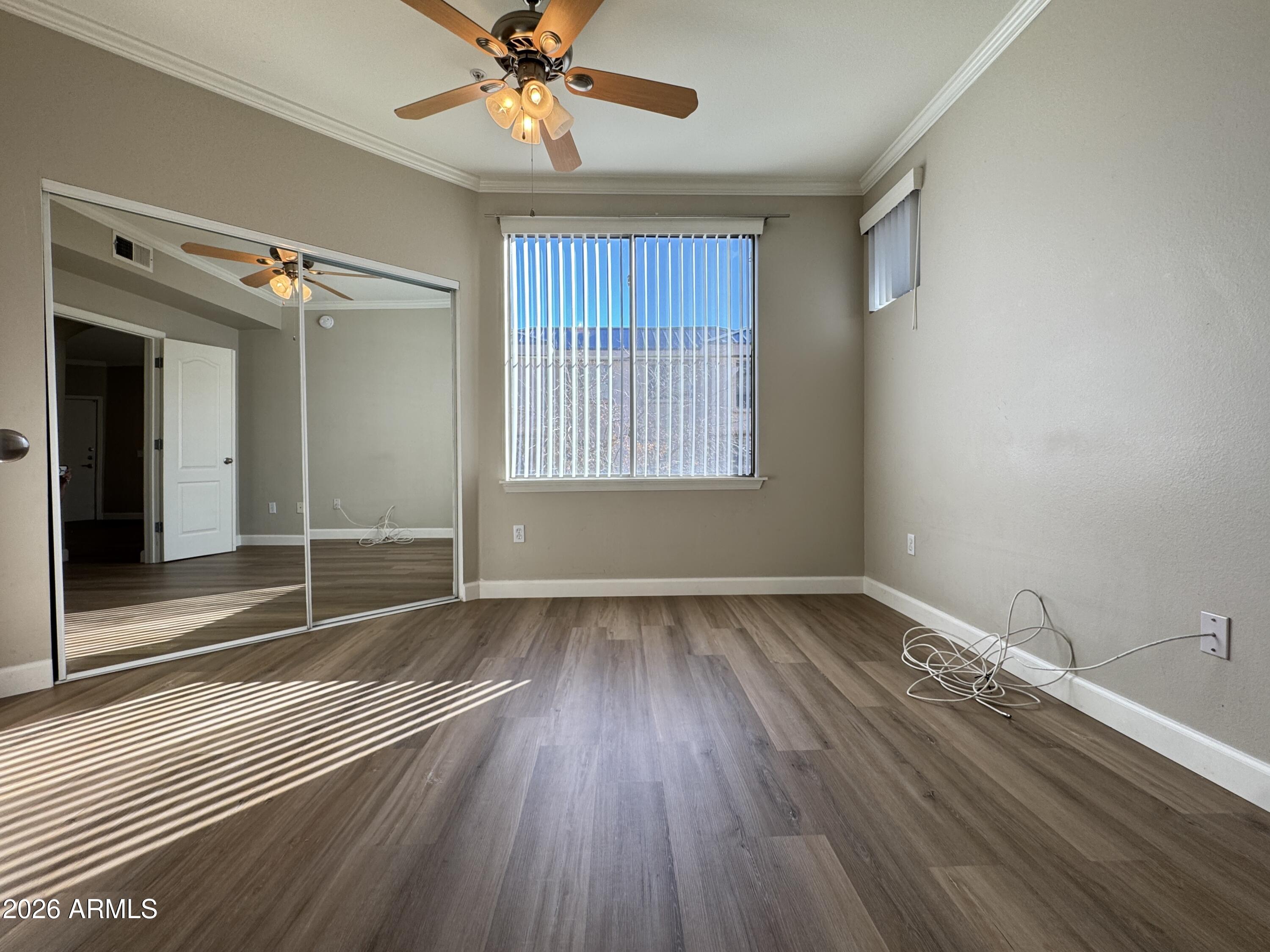 1701 East Colter Street, Unit 291 Phoenix, AZ 85016 - Photo 28 of 32 wooden floor in an empty room with a window