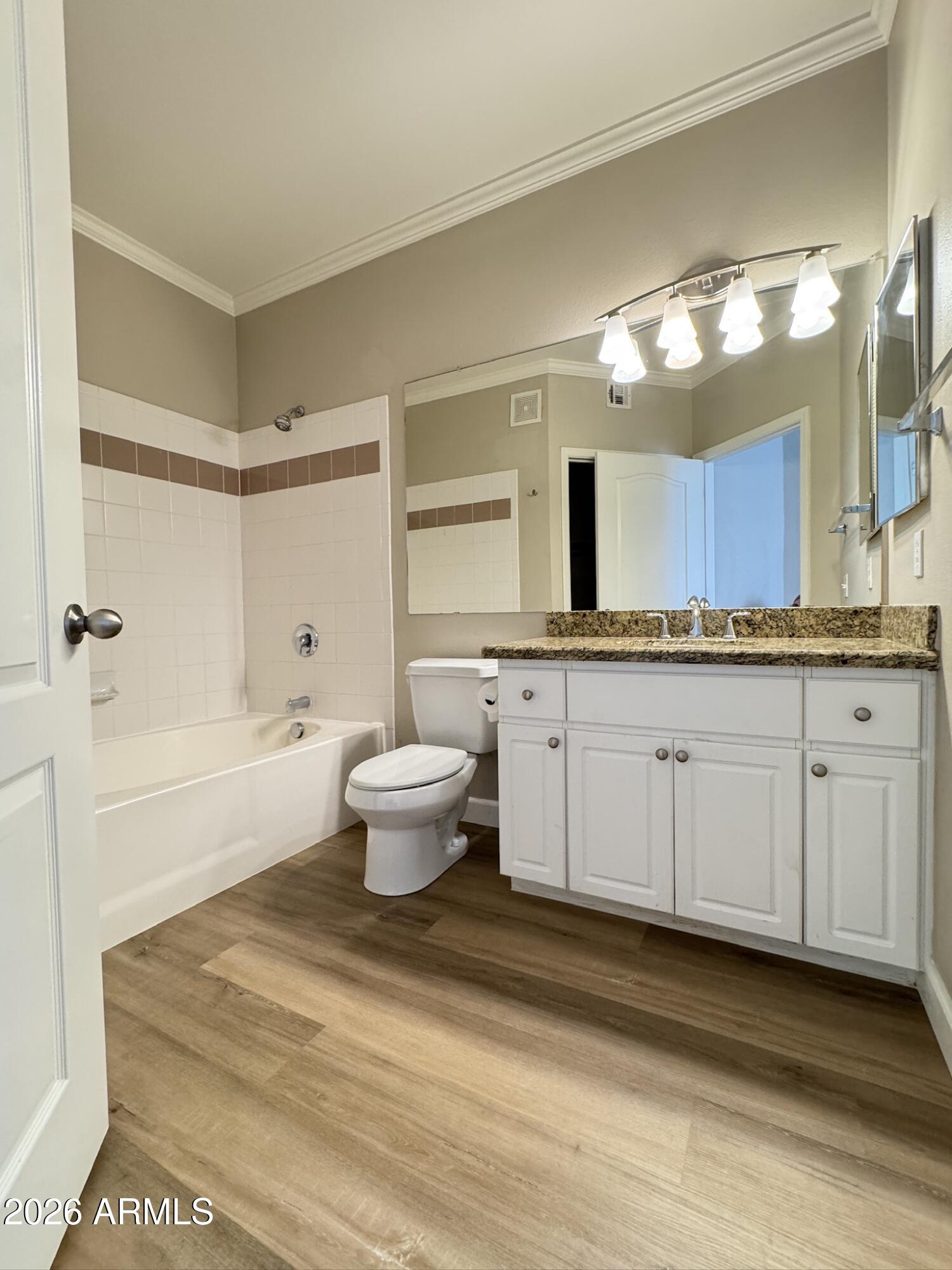 1701 East Colter Street, Unit 291 Phoenix, AZ 85016 - Photo 30 of 32 a spacious bathroom with a granite countertop sink mirror and a bathtub