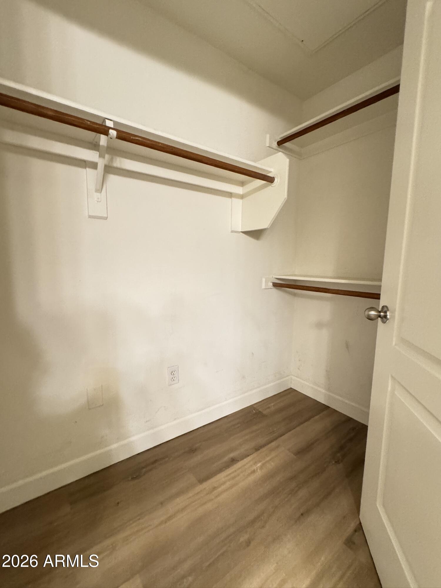 1701 East Colter Street, Unit 291 Phoenix, AZ 85016 - Photo 31 of 32 a view of a room with wooden floor and closet