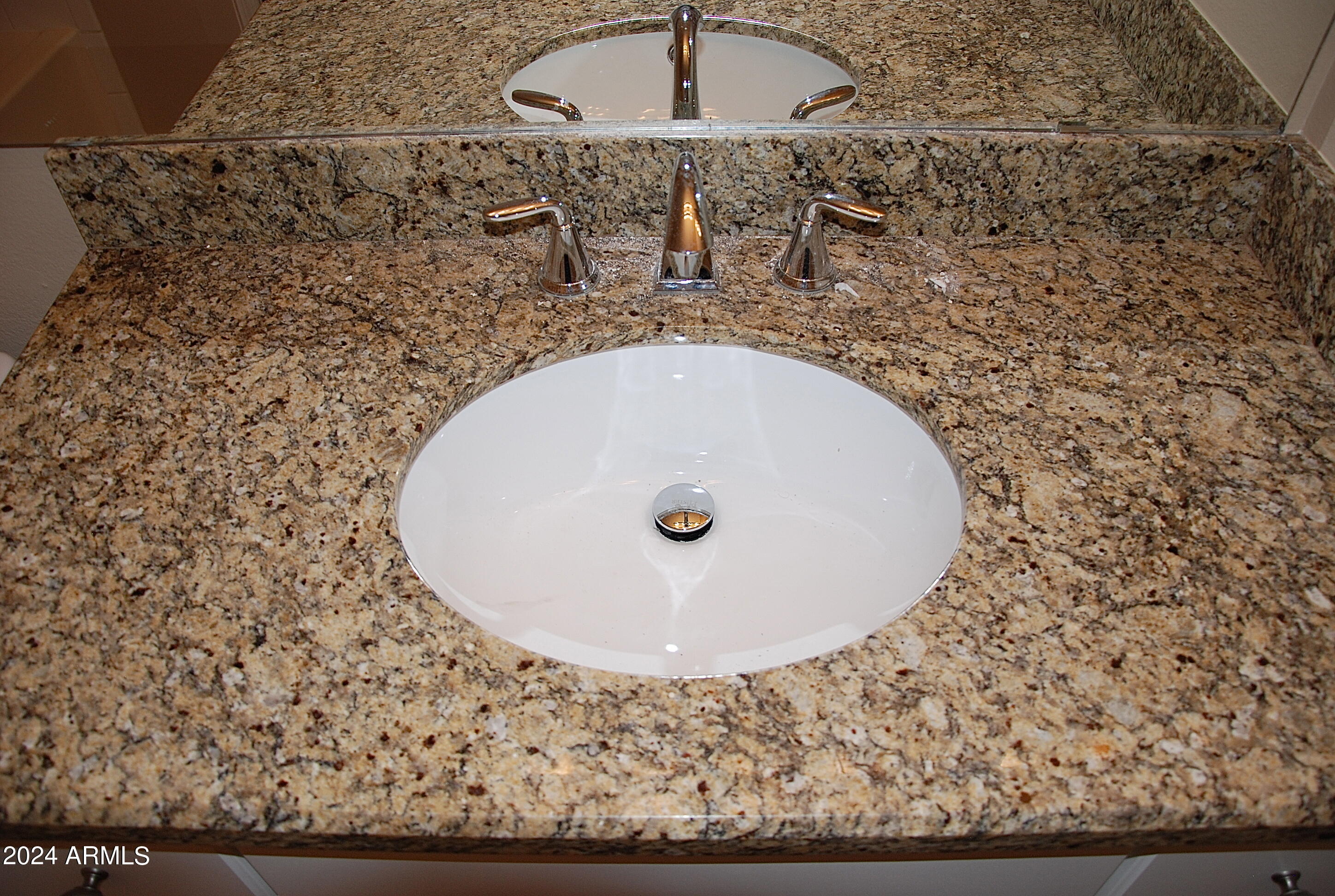 1701 East Colter Street, Unit 291 Phoenix, AZ 85016 - Photo 7 of 32 a bathroom with a granite countertop sink and mirror