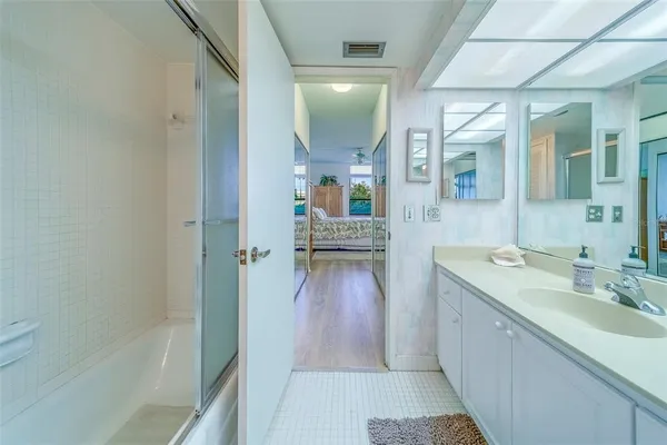a bathroom with a sink and a mirror