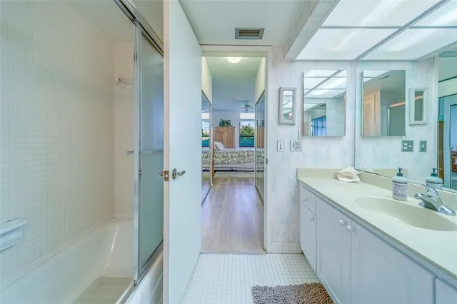 a bathroom with a sink and a mirror