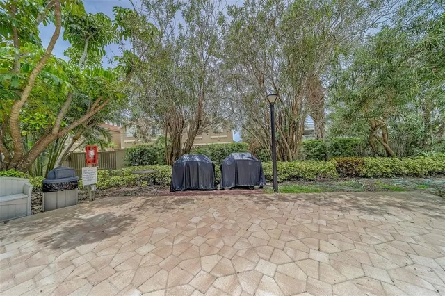 a view of a lake with boats and trees in the background