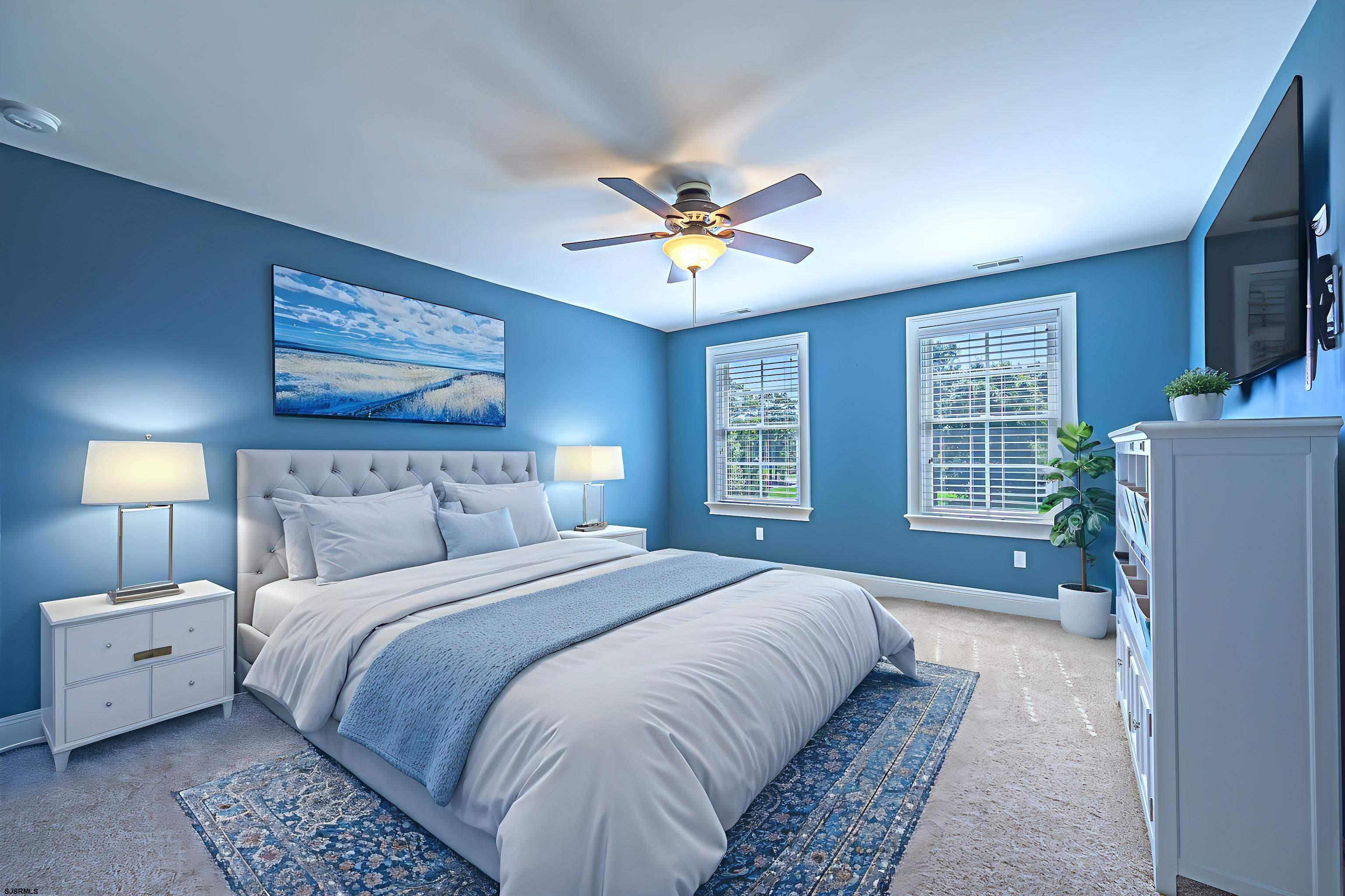 9 Thicket Street Ocean View, NJ 08230 - Photo 20 of 37 a bedroom with a bed and a chandelier