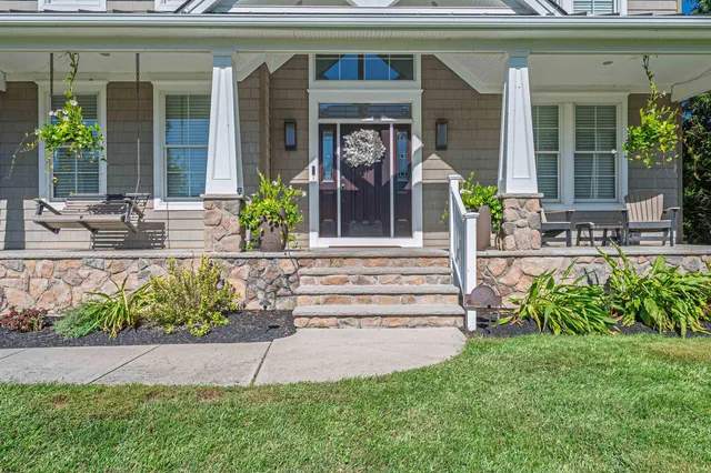 a front view of a house with garden