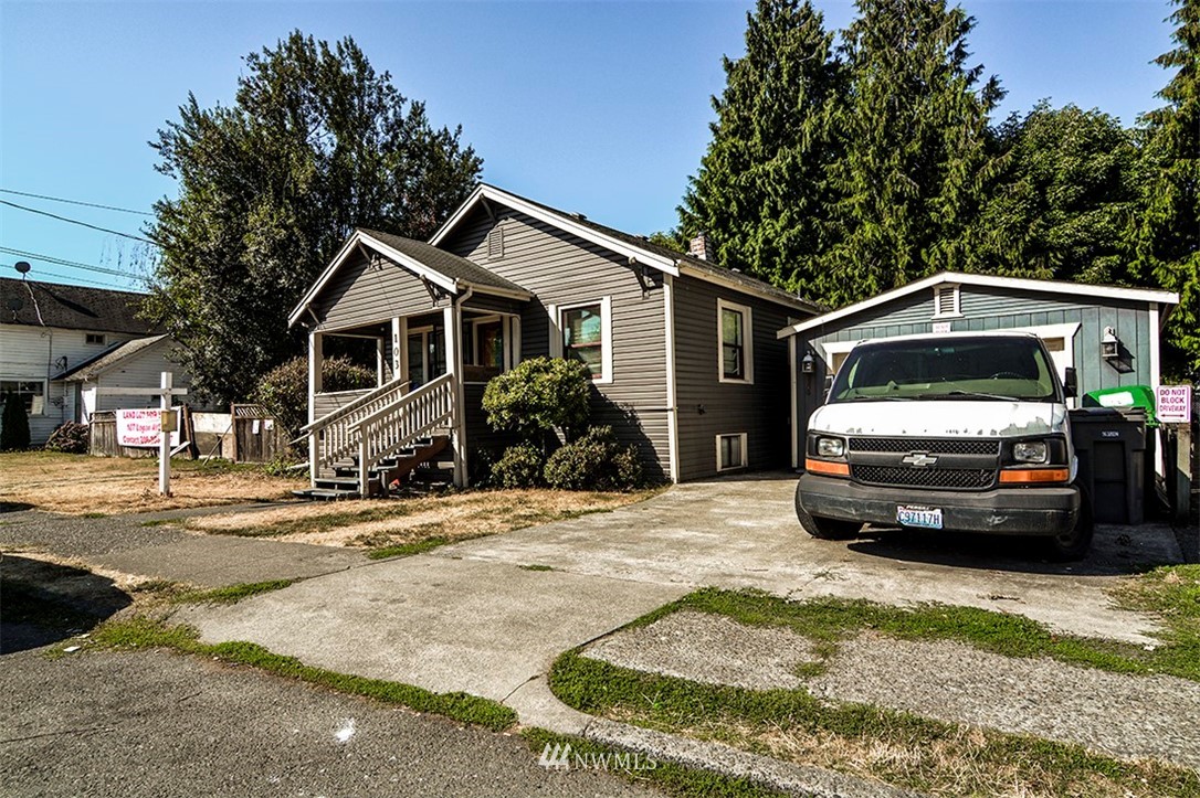 103 Logan Avenue South Renton, WA 98057 - Photo 1 of 19 a car parked in front of a house