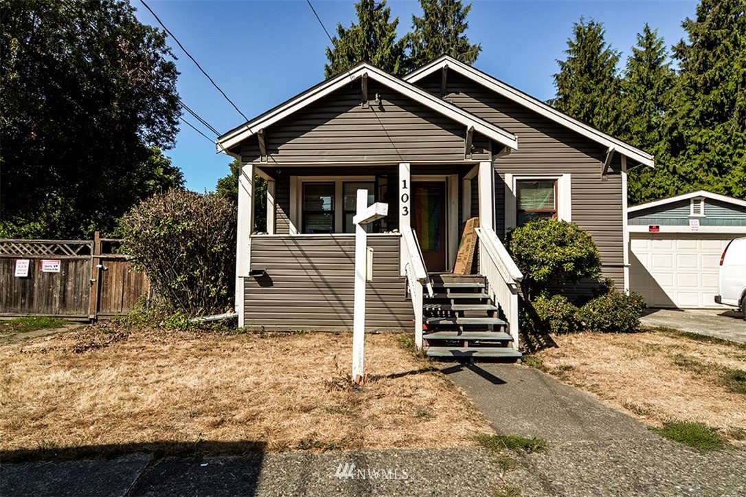 103 Logan Avenue South Renton, WA 98057 - Photo 2 of 19 a front view of a house with a yard