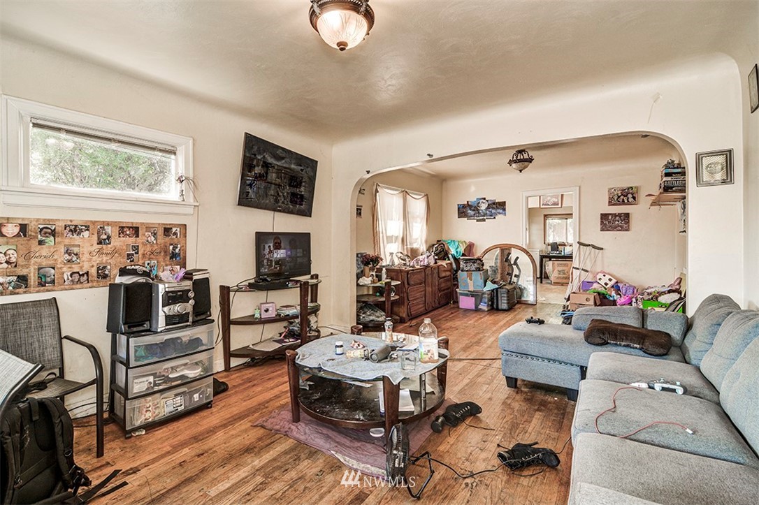 103 Logan Avenue South Renton, WA 98057 - Photo 3 of 19 a living room with furniture and wooden floor