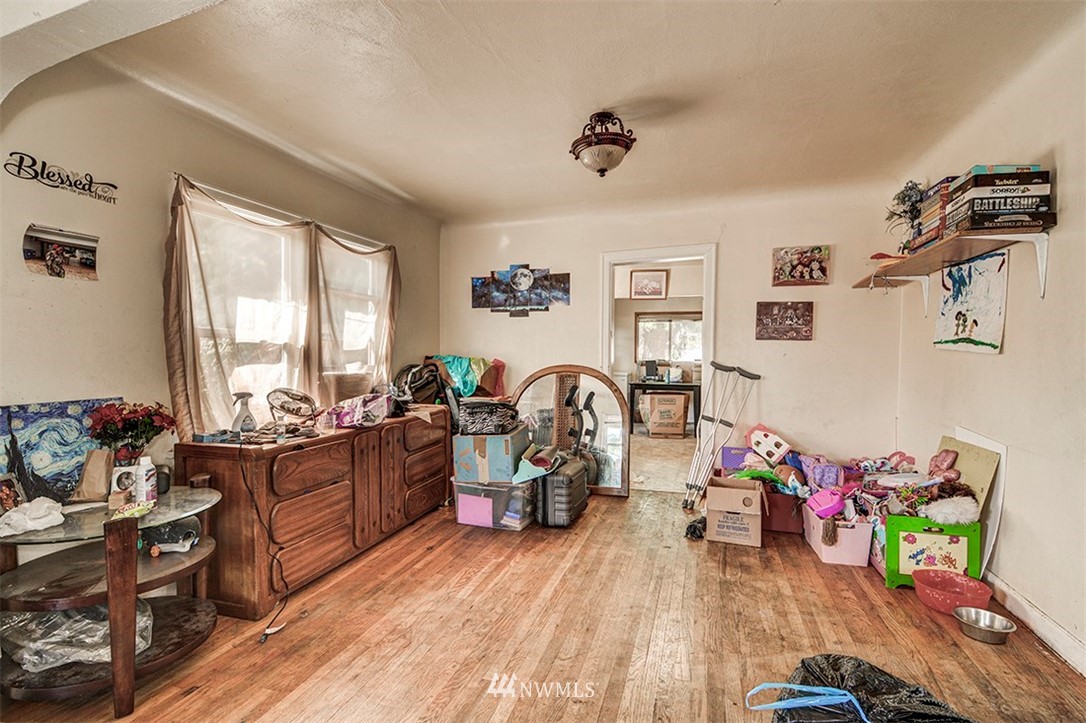 103 Logan Avenue South Renton, WA 98057 - Photo 5 of 19 a living room with furniture window and wooden floor