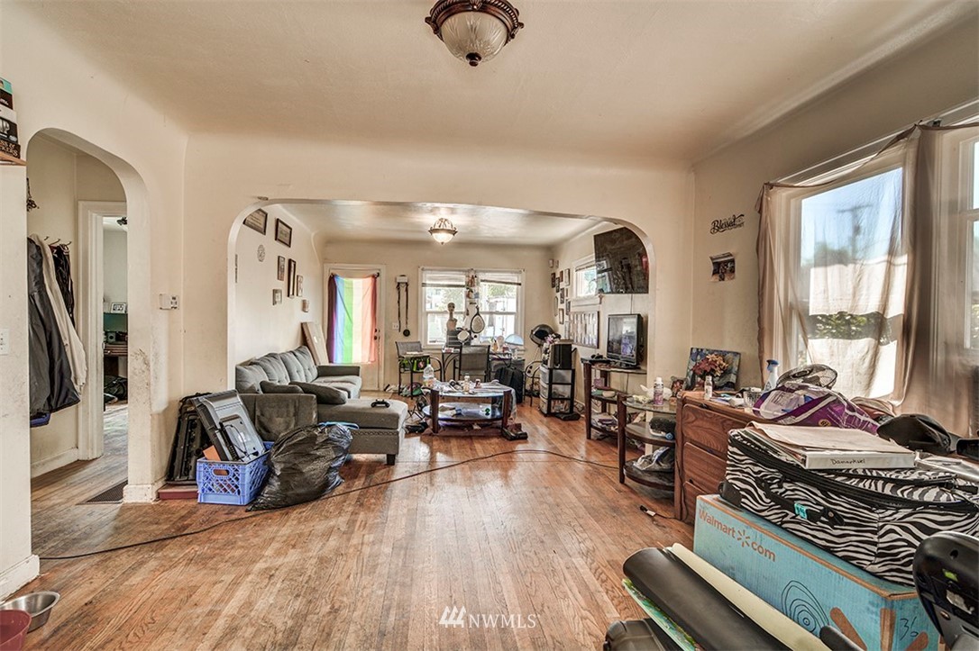 103 Logan Avenue South Renton, WA 98057 - Photo 6 of 19 a living room with furniture fireplace and a large window