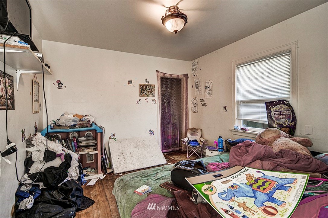 103 Logan Avenue South Renton, WA 98057 - Photo 10 of 19 a bed room with furniture and a window