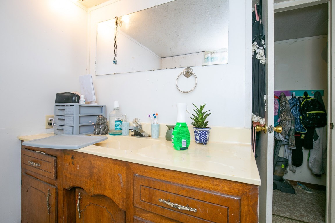 9812 Rocky Point Road Bon Aqua, TN 37025 - Photo 15 of 48 a room with a sink and a potted plant