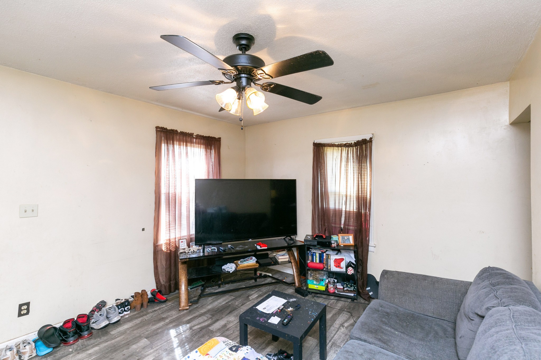 9812 Rocky Point Road Bon Aqua, TN 37025 - Photo 27 of 48 a living room with furniture and a flat screen tv