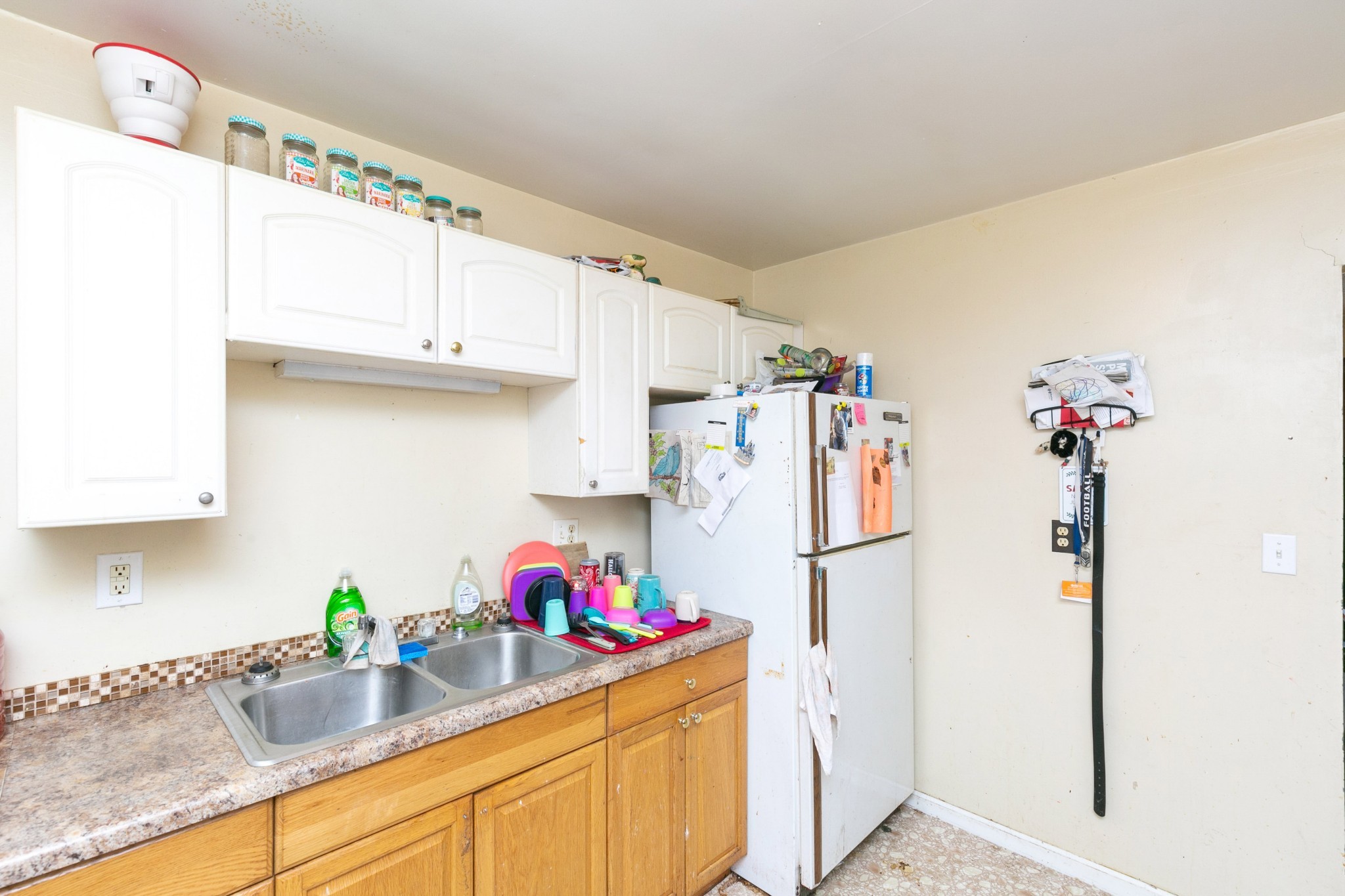 9812 Rocky Point Road Bon Aqua, TN 37025 - Photo 30 of 48 a kitchen with a refrigerator and a sink