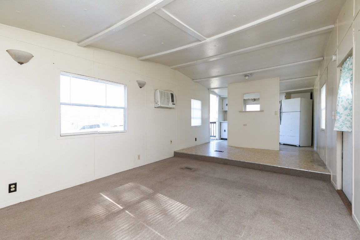 9812 Rocky Point Road Bon Aqua, TN 37025 - Photo 4 of 48 an empty room with windows and entrance