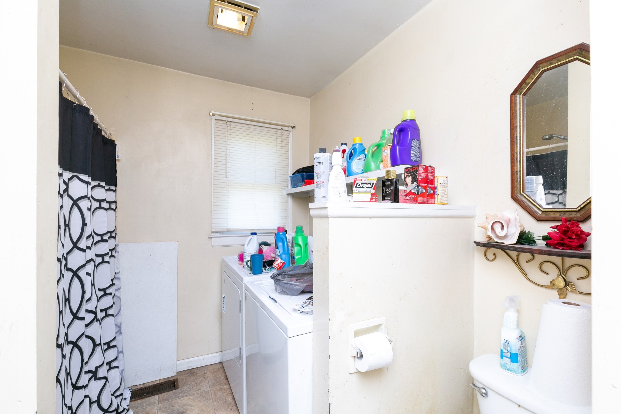 9812 Rocky Point Road Bon Aqua, TN 37025 - Photo 32 of 48 a room with a refrigerator and a sink