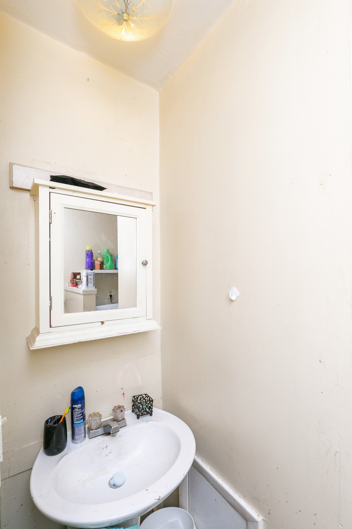 9812 Rocky Point Road Bon Aqua, TN 37025 - Photo 33 of 48 a bathroom with a sink and a mirror