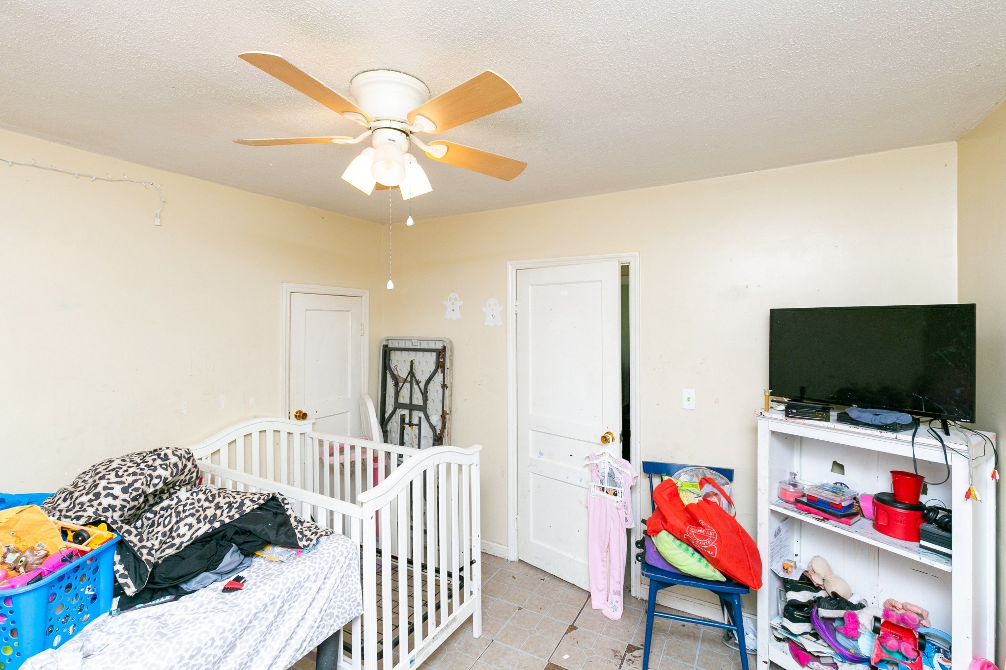 9812 Rocky Point Road Bon Aqua, TN 37025 - Photo 34 of 48 a bedroom with furniture and a flat screen tv