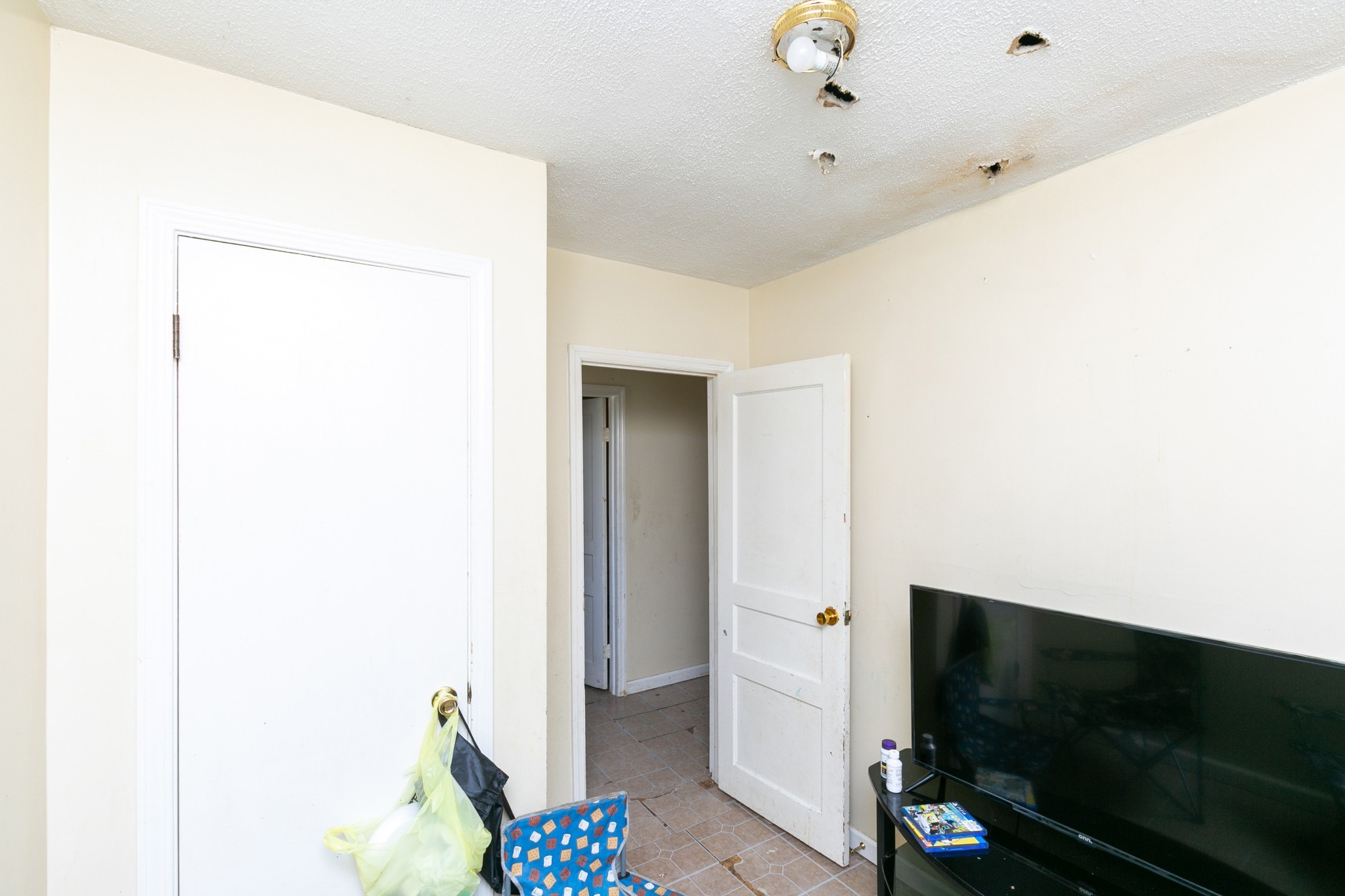 9812 Rocky Point Road Bon Aqua, TN 37025 - Photo 36 of 48 a living room with furniture and a flat screen tv
