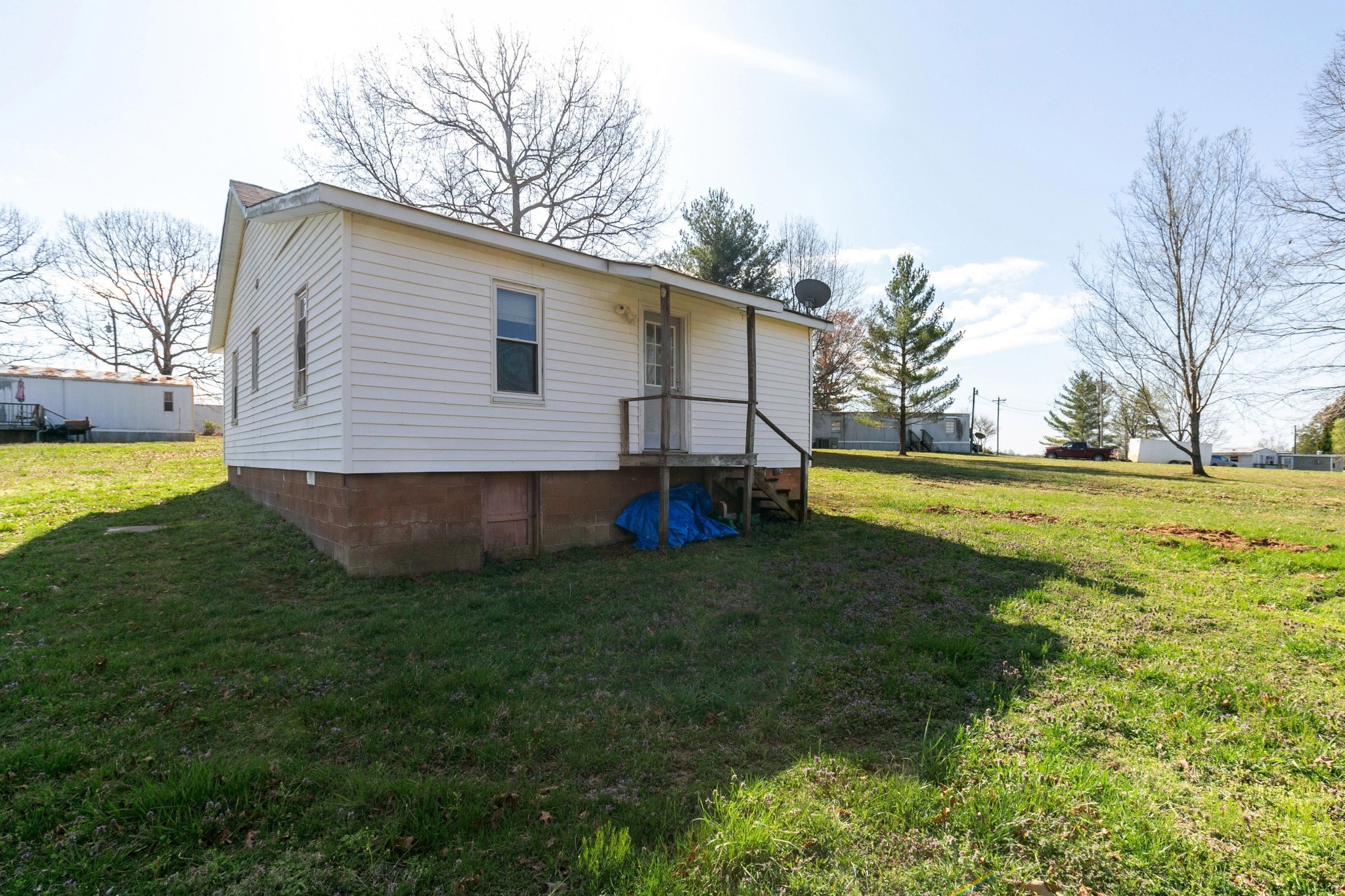9812 Rocky Point Road Bon Aqua, TN 37025 - Photo 37 of 48 a view of a backyard with a garden