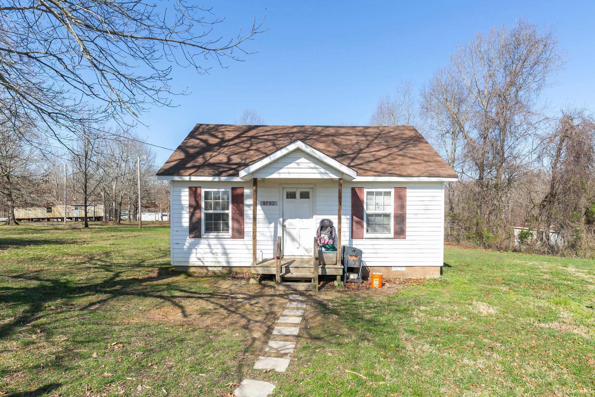 9812 Rocky Point Road Bon Aqua, TN 37025 - Photo 38 of 48 a view of a house with backyard and trees