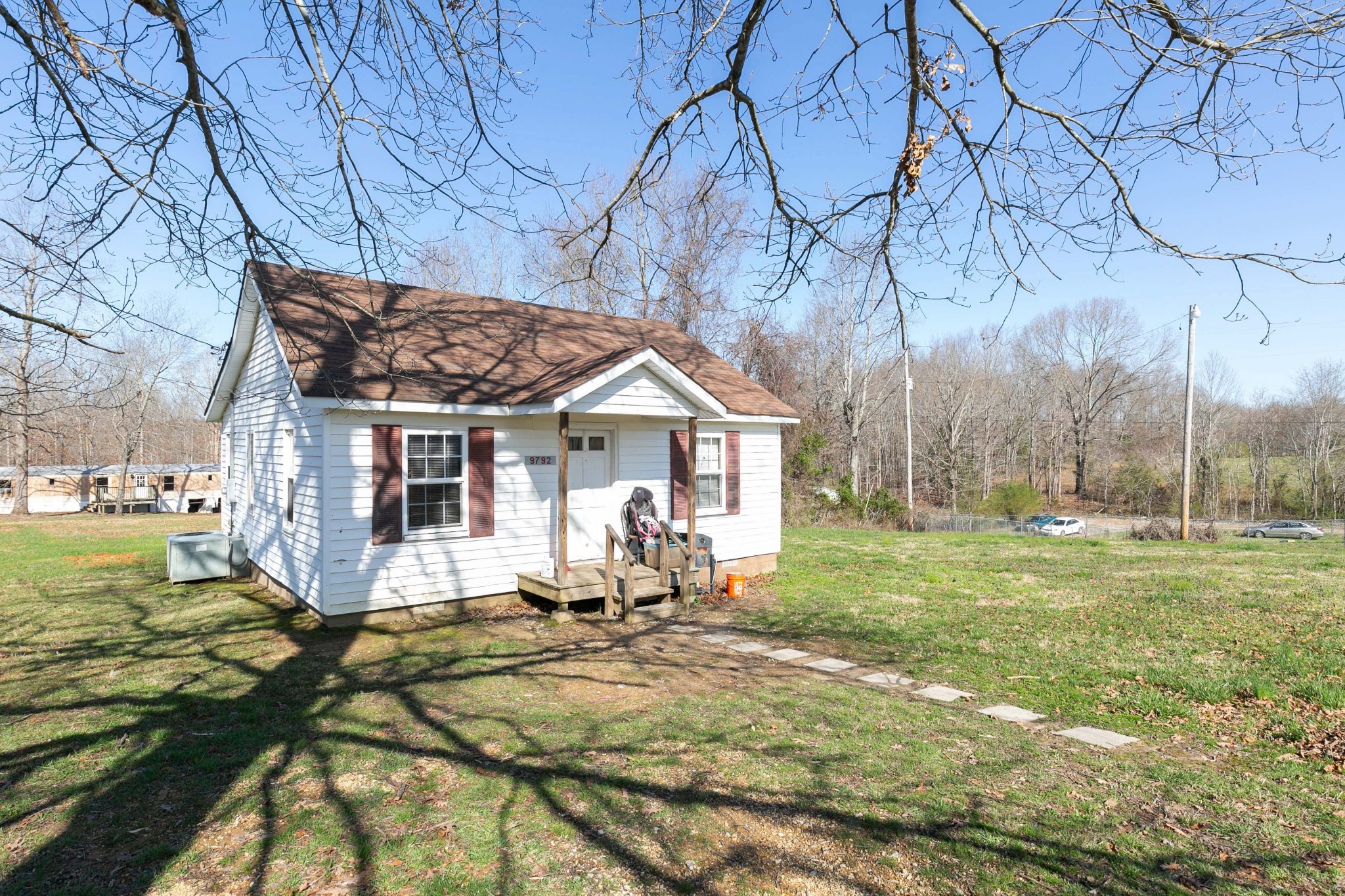 9812 Rocky Point Road Bon Aqua, TN 37025 - Photo 39 of 48 a view of a house with a yard