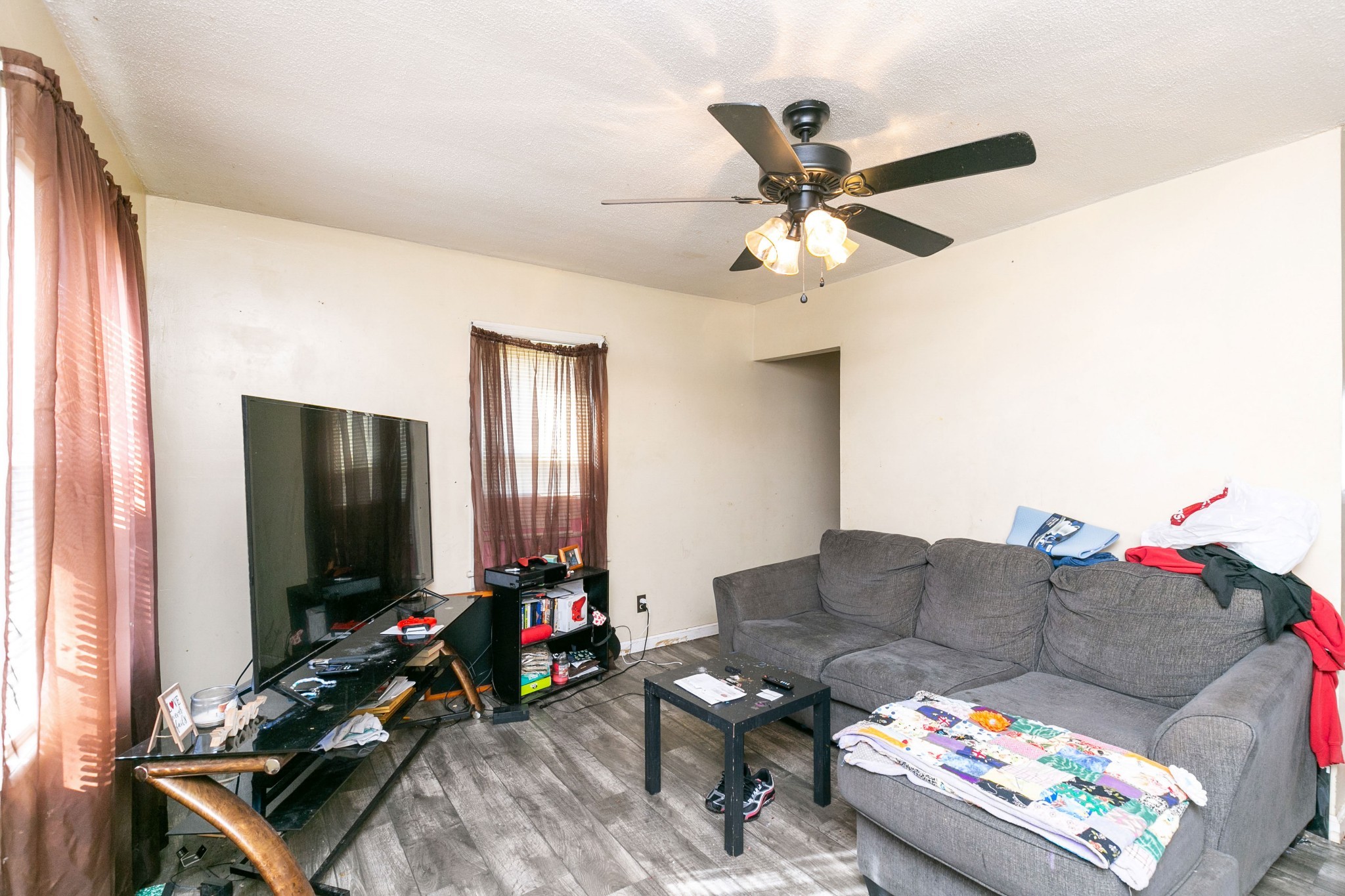 9812 Rocky Point Road Bon Aqua, TN 37025 - Photo 40 of 48 a living room with furniture and a flat screen tv
