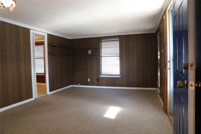 a kitchen with cabinets and wooden floor