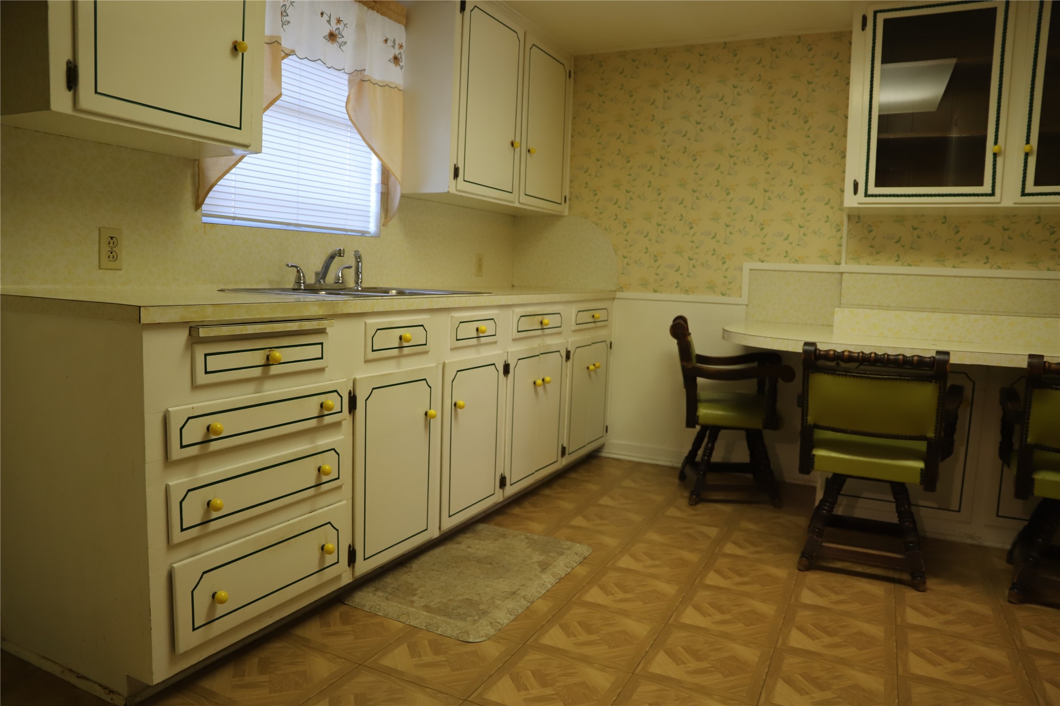 6106 Felix Avenue Austin, TX 78741 - Photo 15 of 20 a kitchen with cabinets and wooden floor