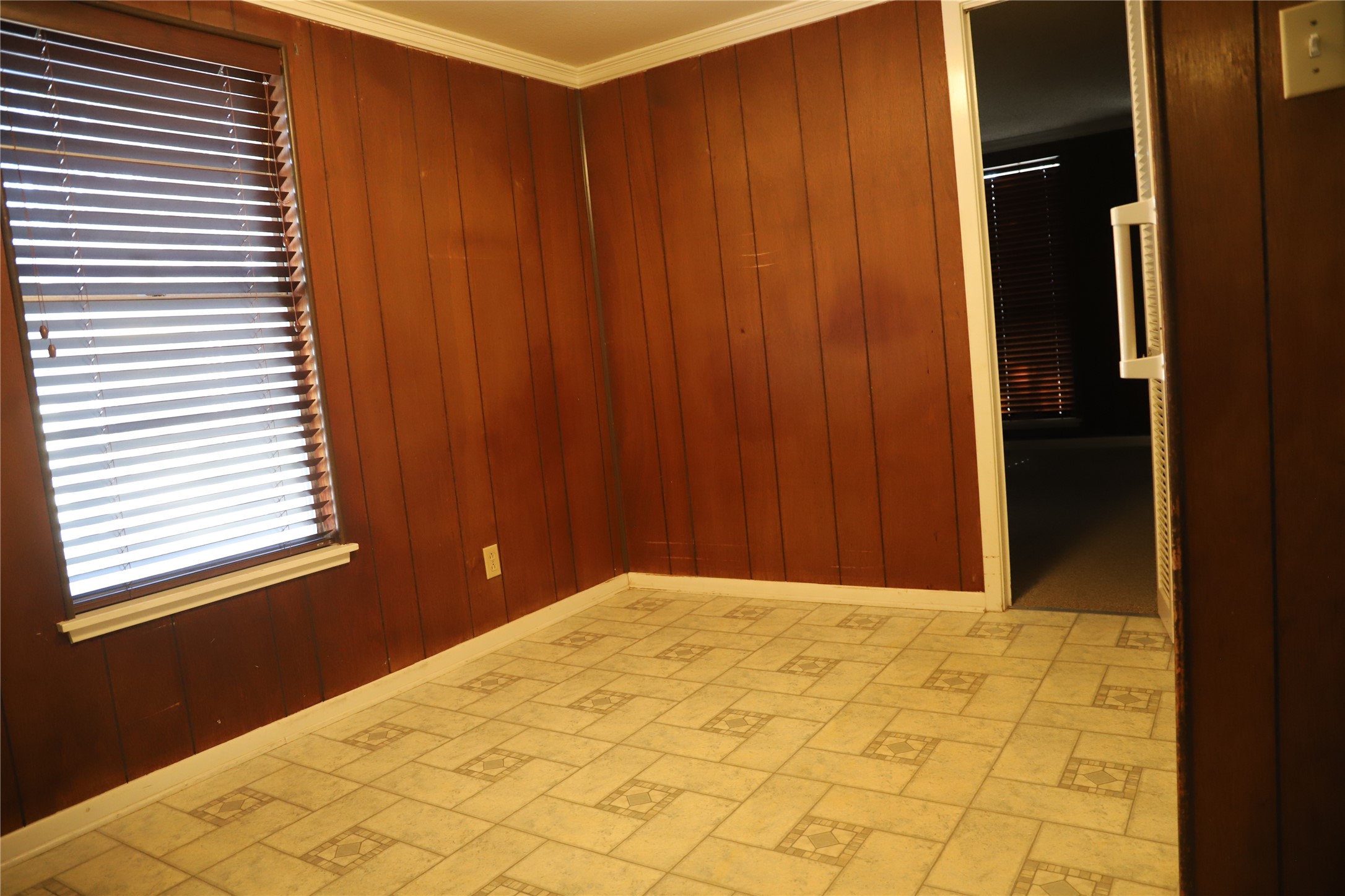 6106 Felix Avenue Austin, TX 78741 - Photo 7 of 20 a view of a room with window and wooden walls