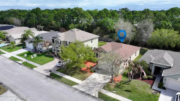an aerial view of a house with a garden