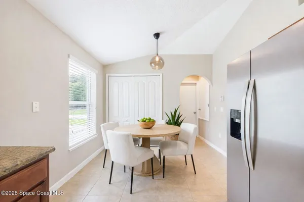 a dining room with furniture window and entryway