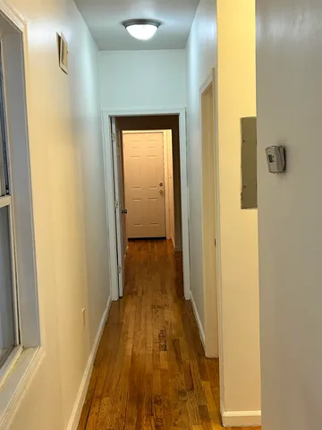 a view of a bathroom from a hallway