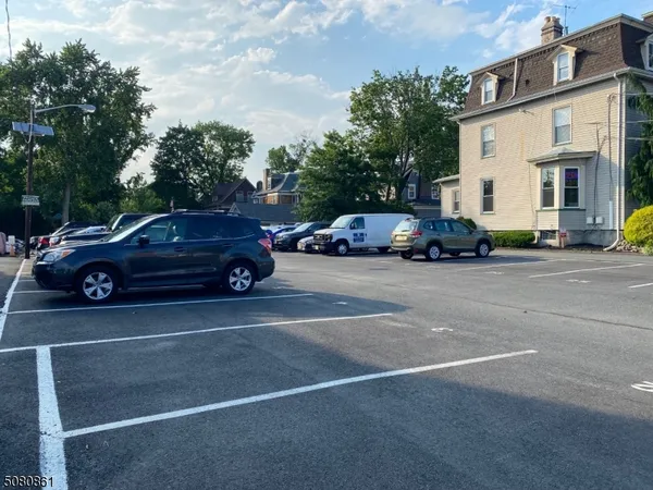 a view of a cars parked in front of a house