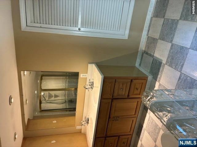19 Crescent Road Wayne, NJ 07470 - Photo 12 of 26 a bathroom with a sink and a mirror