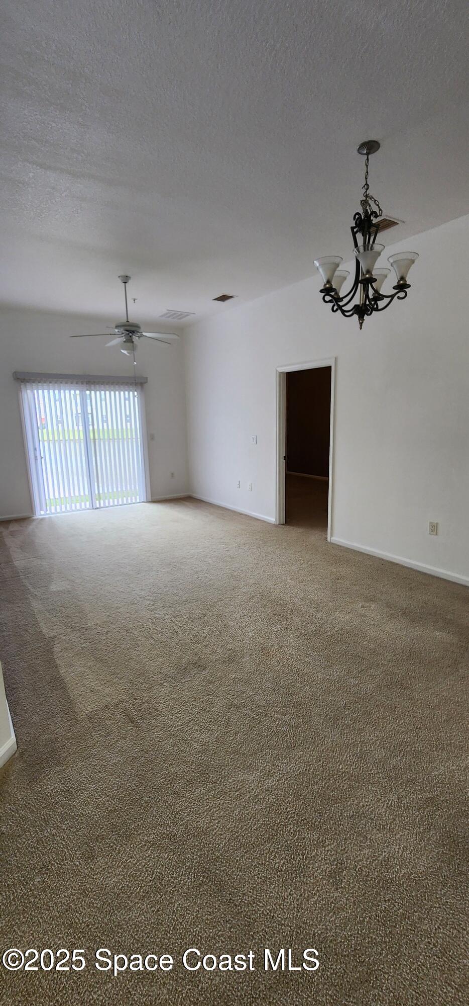 4076 Meander Place, Unit 103 Rockledge, FL 32955 - Photo 13 of 24 a view of an empty room with a window