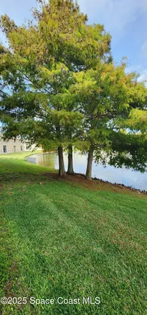 a view of a lake with a building in the background
