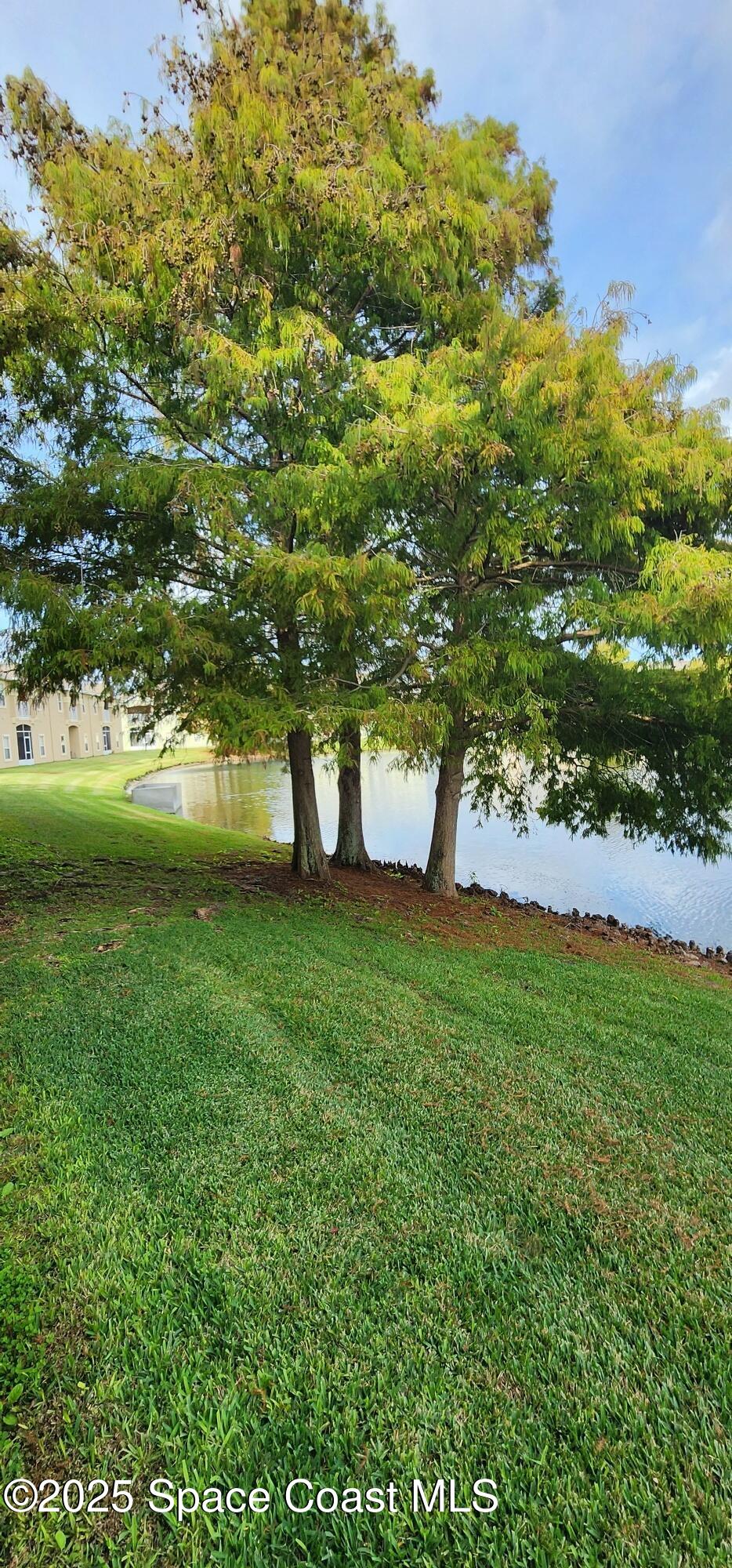 4076 Meander Place, Unit 103 Rockledge, FL 32955 - Photo 21 of 24 a view of outdoor space with deck and green space