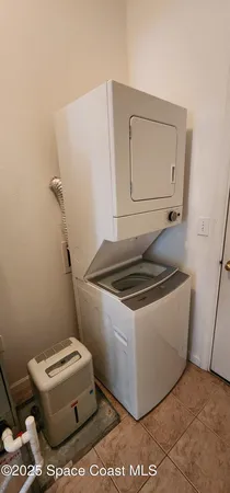 a white stove sitting next to a white toilet