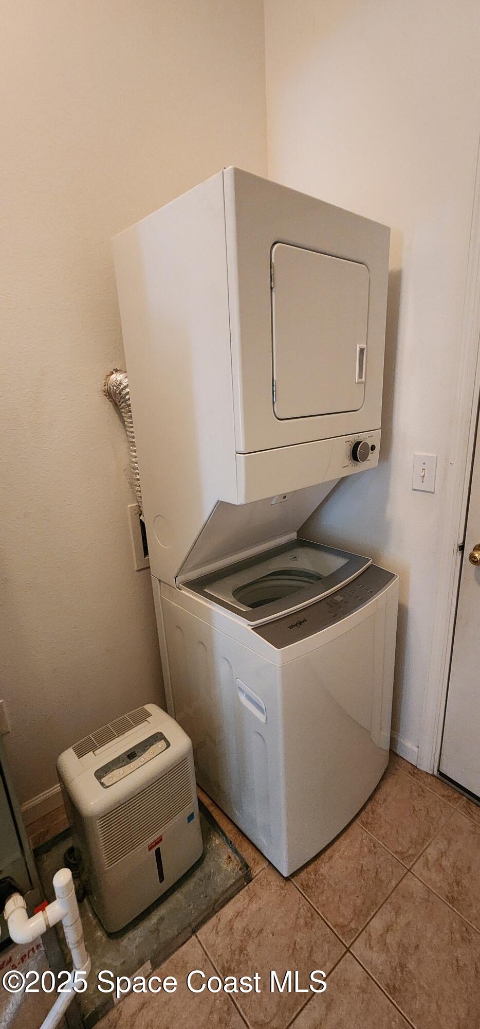 4076 Meander Place, Unit 103 Rockledge, FL 32955 - Photo 3 of 24 a white stove sitting next to a white toilet