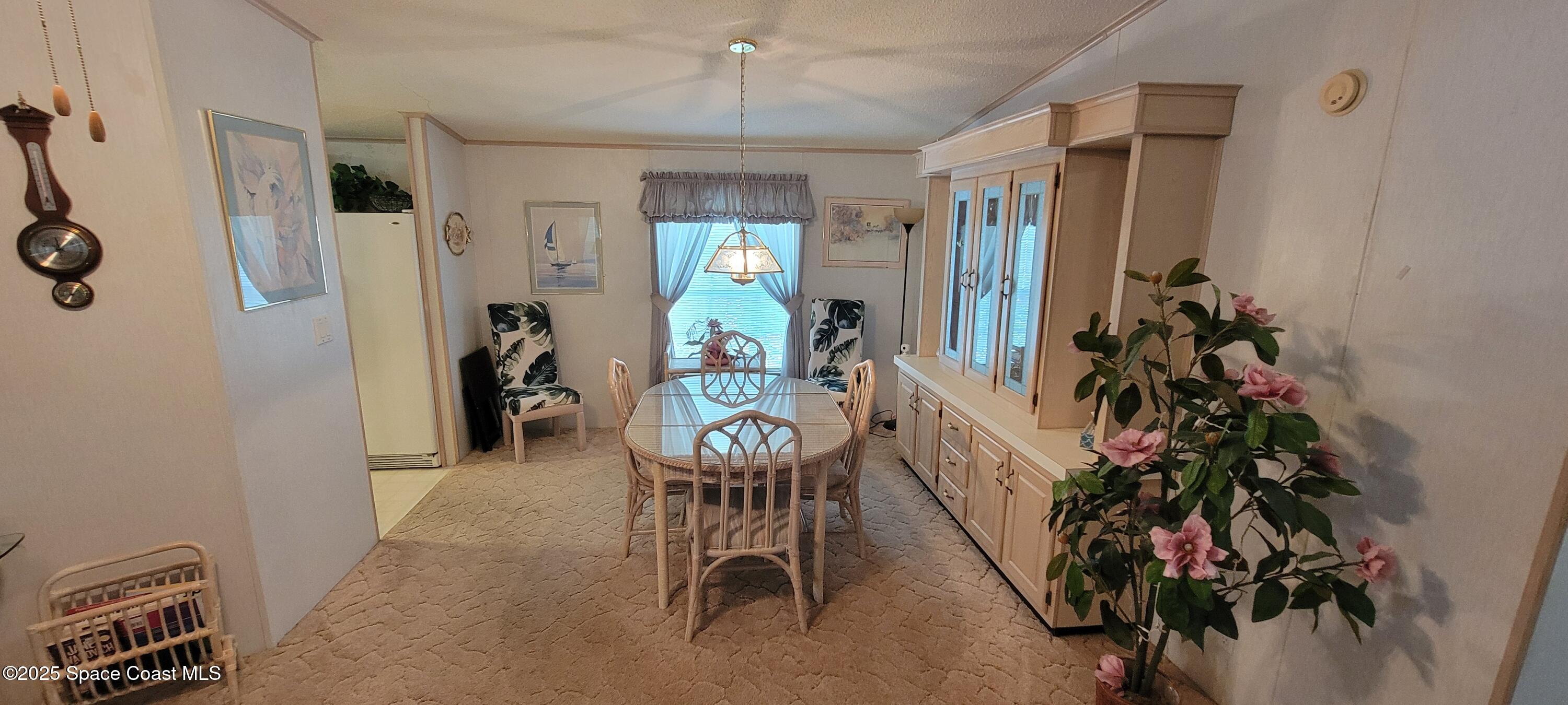 474 Marlin Circle Barefoot Bay, FL 32976 - Photo 3 of 14 a living room with furniture and a potted plant