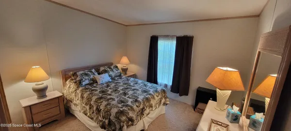 a bed room with a bed and a lamp